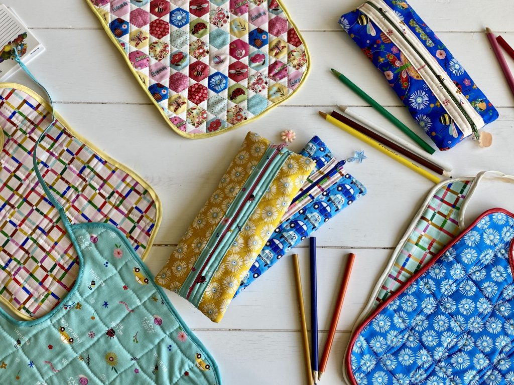 Colorful Bibs & Pencil Cases with Hey, Love&nbsp;Bug